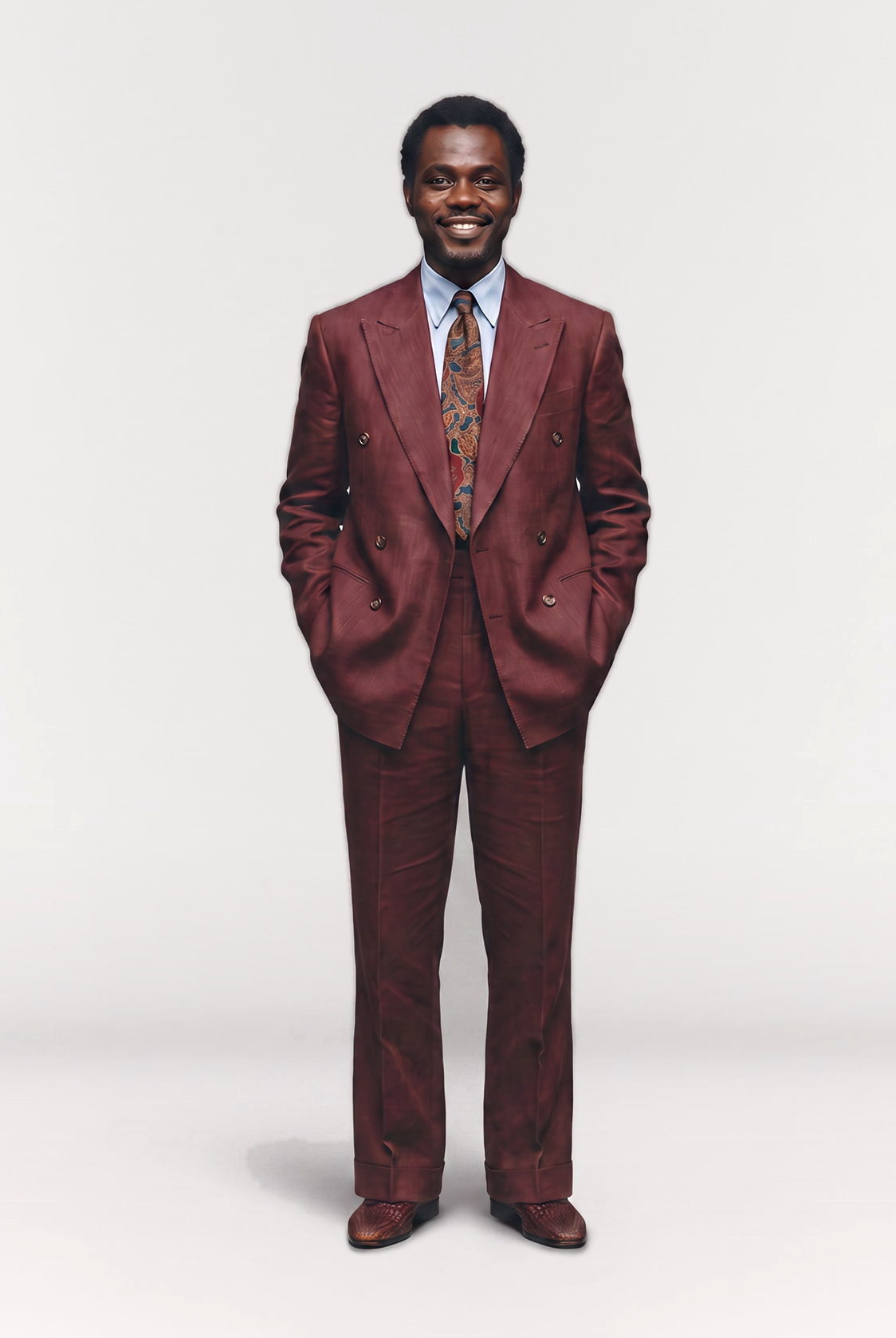 Man in a burgundy double breasted suit and paisley tie, full figure studio shot